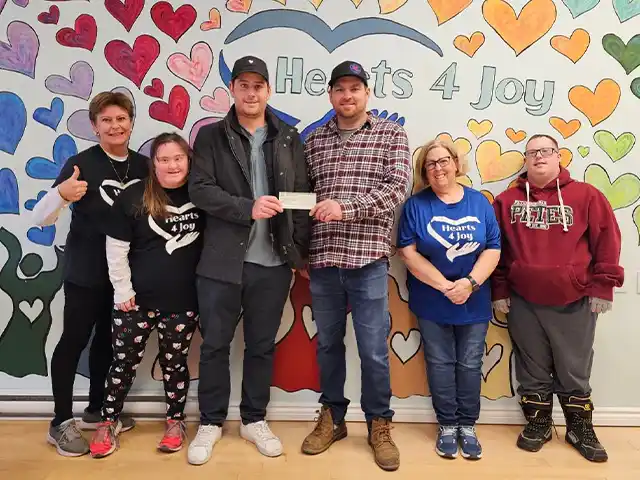 2023 charitable donation presentation for Hearts 4 Joy